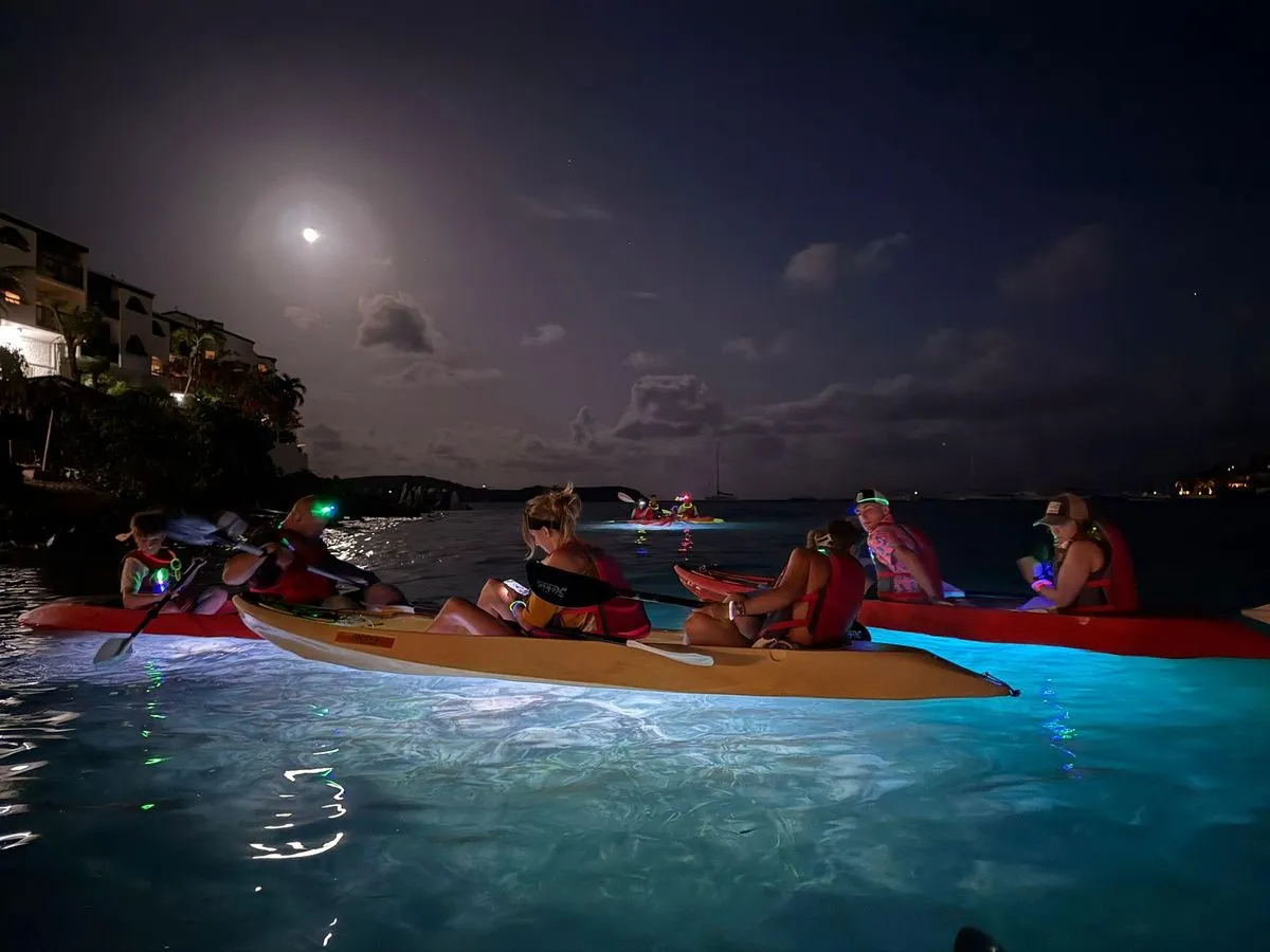An LED-lit night kayak glowing on the water, a unique thing to do in St. Thomas, U.S. Virgin Islands