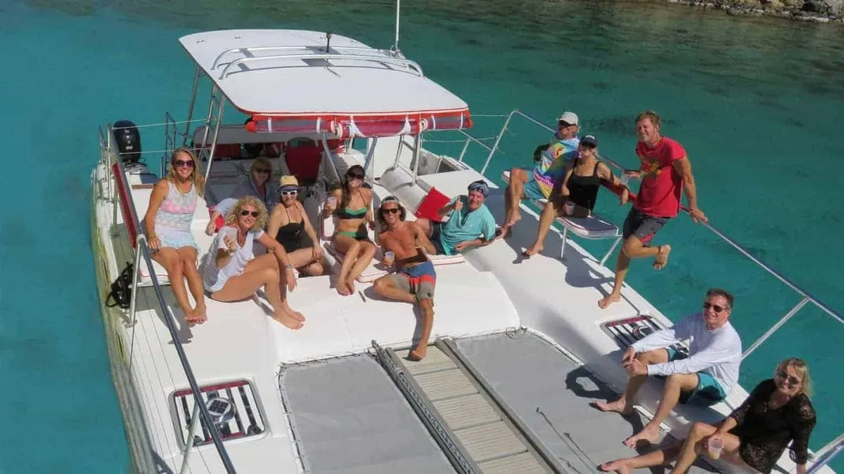 A private catamaran anchored off a beach, a splurge-worthy thing to do in St. Thomas, U.S. Virgin Islands
